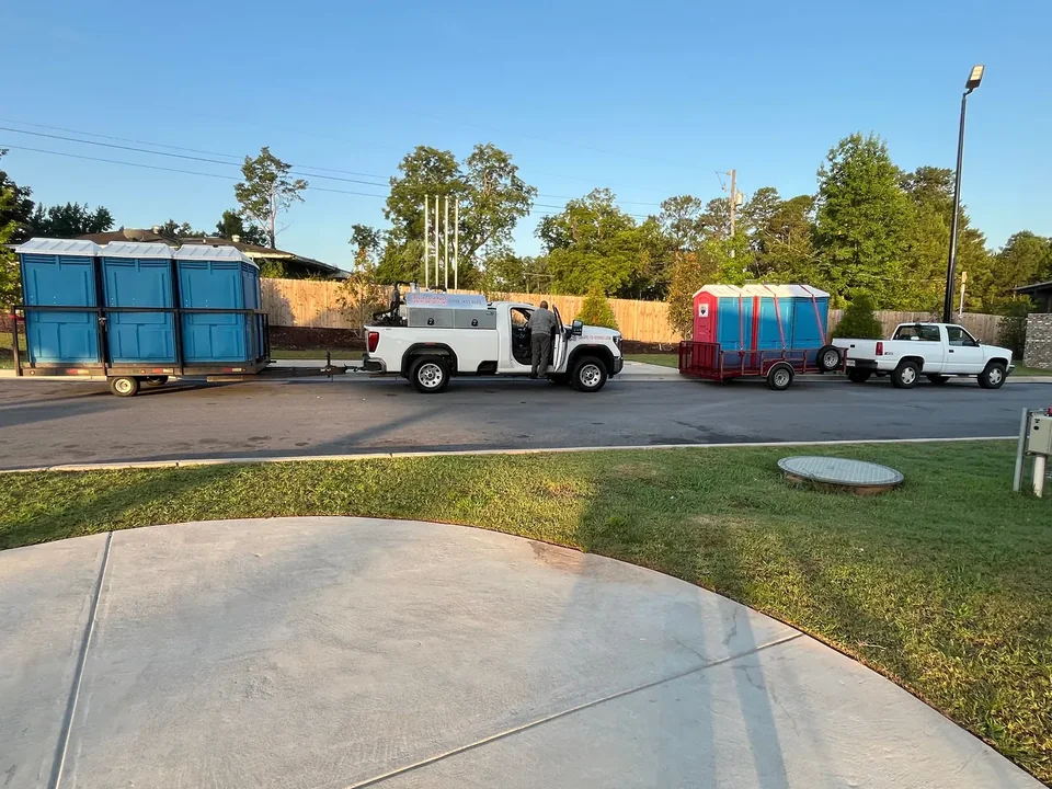 S2S trucks with trailers loaded with portable restrooms